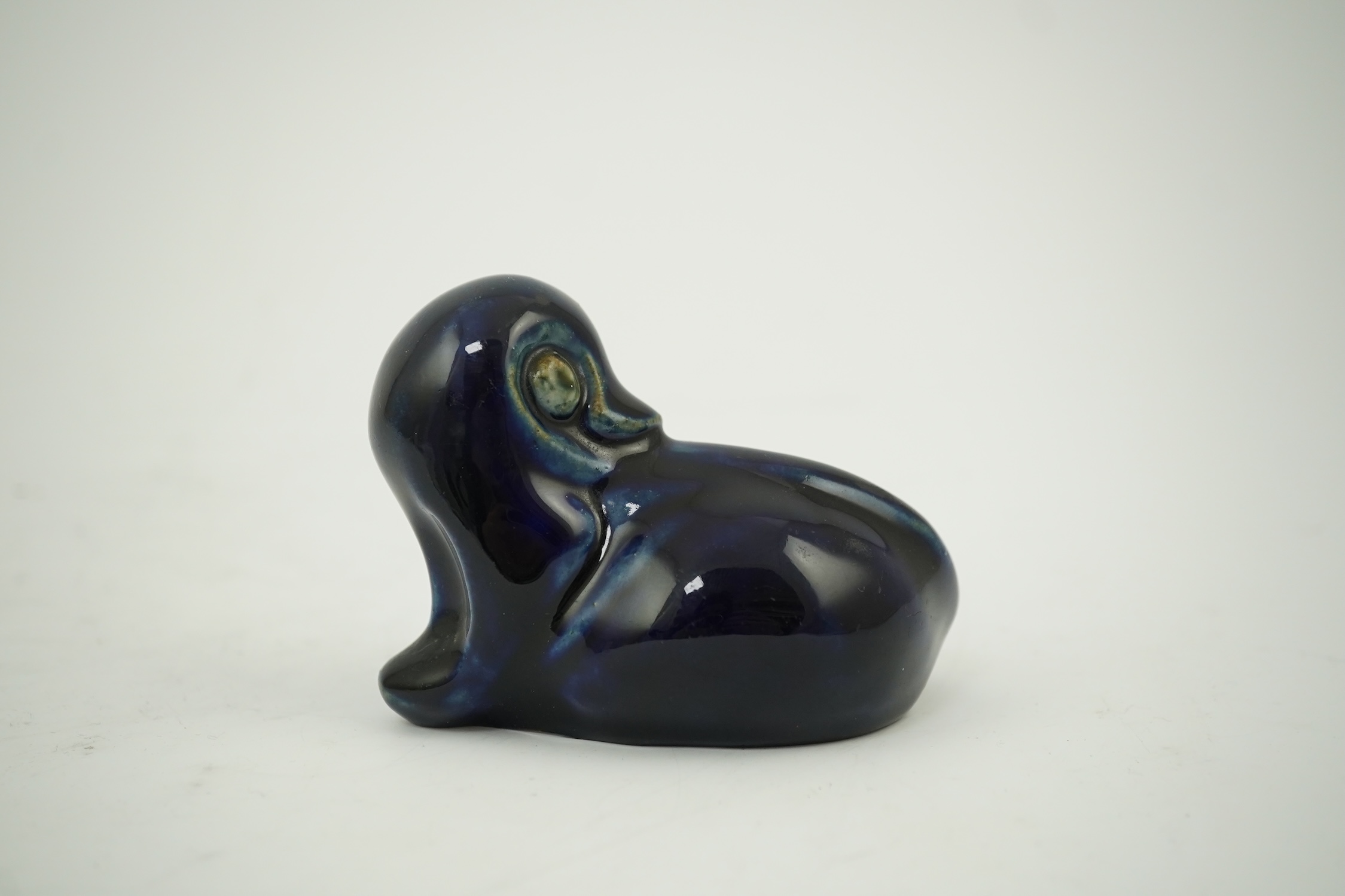 A Royal Doulton stoneware grotesque blue glazed 'duck' by Mark V. Marshall, 9cm wide. Condition - good